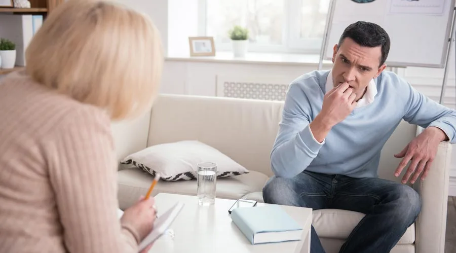 Man sitting in therapy session with counselor - Expert Help with Alcohol Tapering at Icarus Recovery Center in New Mexico