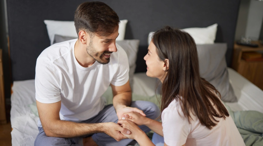 Image of a couple embracing in a moment of reconciliation, symbolizing forgiveness and healing after addiction